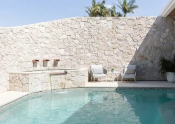 Natural stone wall pool waterfall lounge chairs Natural stone wall pool waterfall lounge chairs